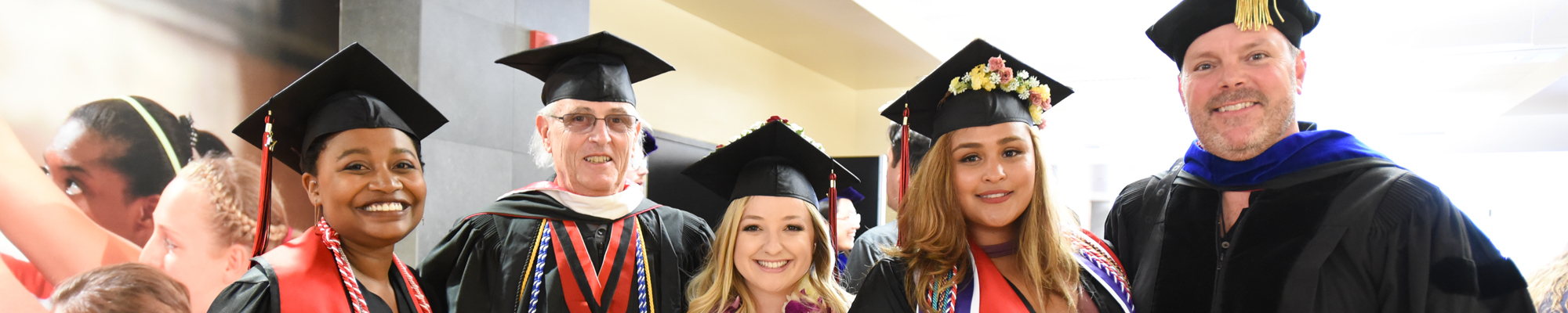 faculty and students at graduation